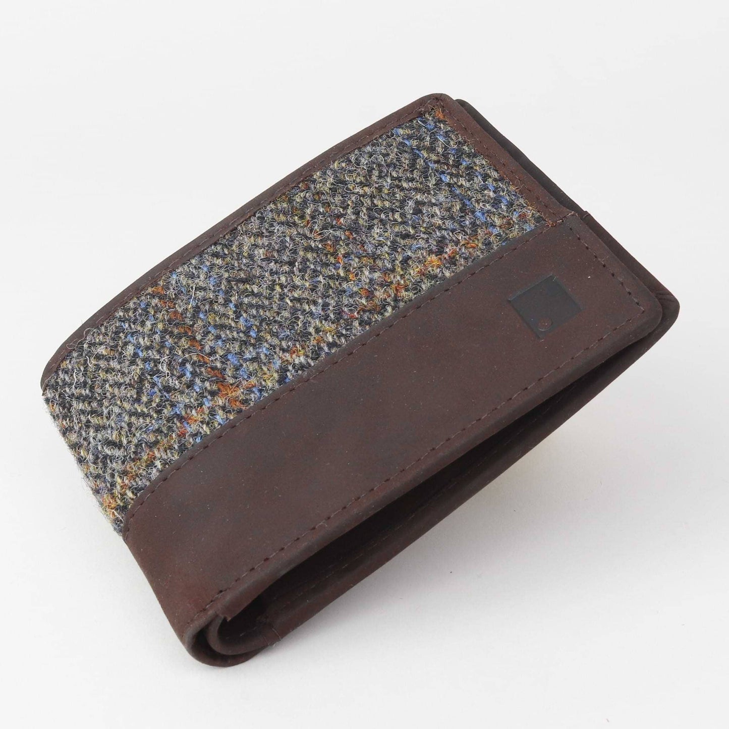 Brown leather wallet with tweed pattern on a white background
