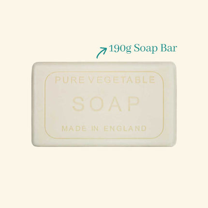 Bar of soap labeled 'Pure Vegetable Soap Made in England' with a weight indication on a beige background.