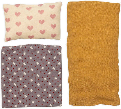 Three fabric swatches with different patterns on a white background