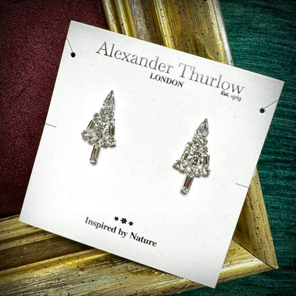 Tree-shaped earrings on a 'Alexander Thurlow London' card with a nature theme.