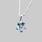 Silver necklace with a blue flower pendant on a gray stone background
