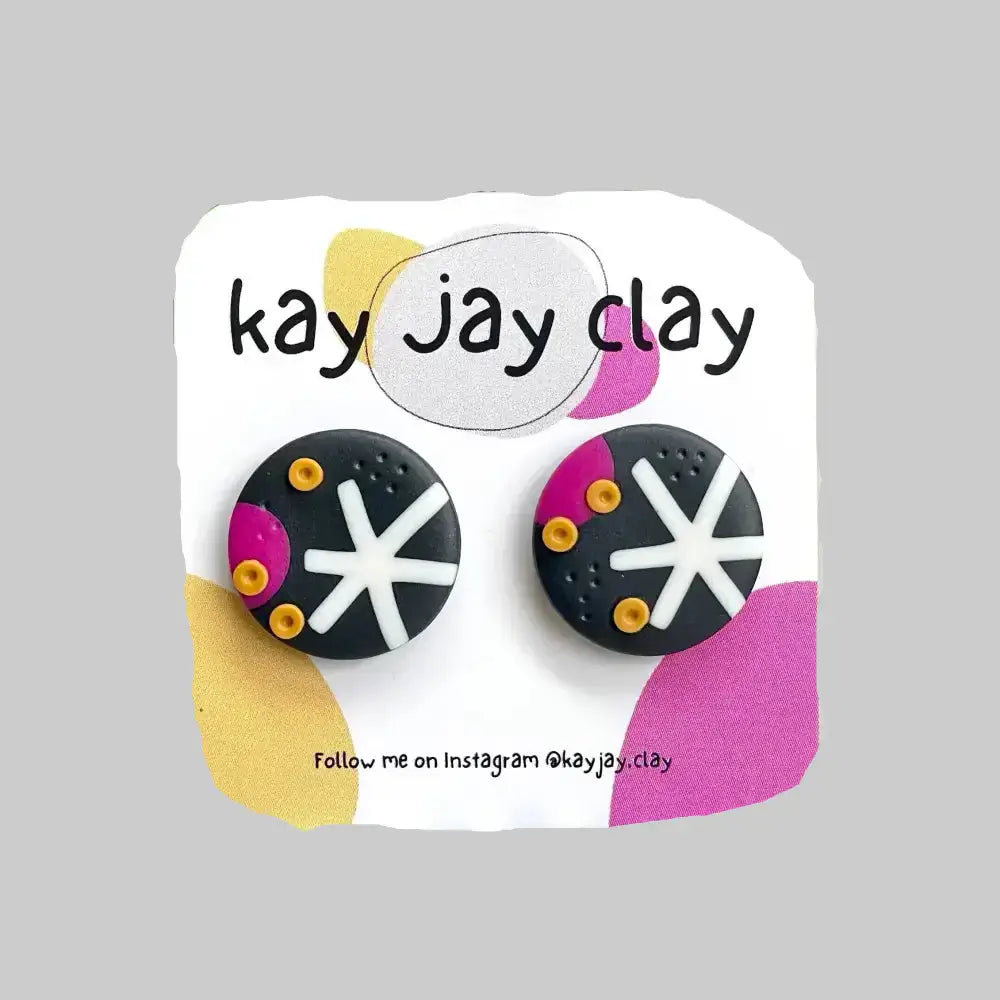 Colorful earrings on a 'kay jay clay' branded card 