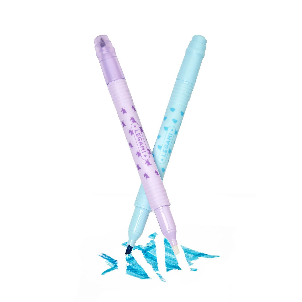 Two pastel-colored pens with blue ink splashes on a white background