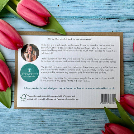 Card with text and Jen Winnett Eco-Artist branding surrounded by red tulips on a blue wooden surface