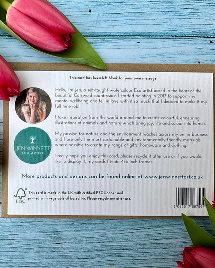 Card with text and Jen Winnett Eco-Artist branding surrounded by red tulips on a blue wooden surface