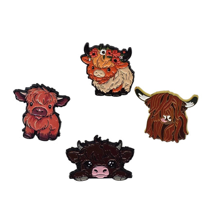 Four highland cow pins on a light gray background