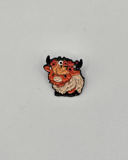 Small cow pin on a gray background
