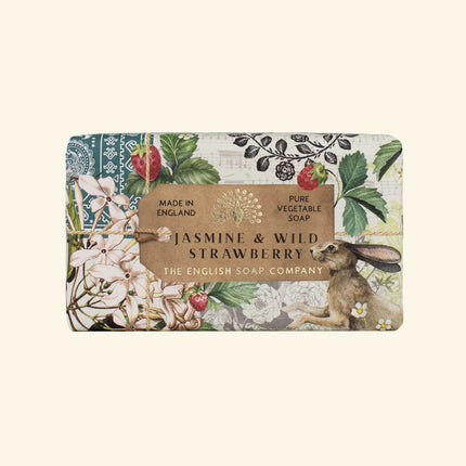 Soap bar with floral design and rabbit illustration on a white background
