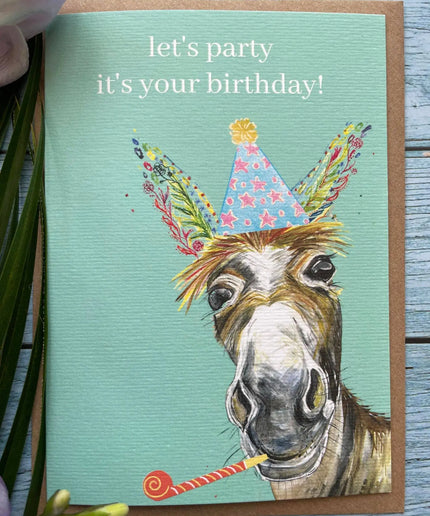 Birthday card with a donkey wearing a party hat and the text 'let's party it's your birthday!' on a teal background.