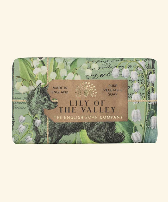 Soap bar with 'Lily of the Valley' design and branding on a beige background