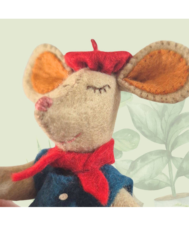 Stuffed mouse toy with a red bow tie and blue vest on a light background