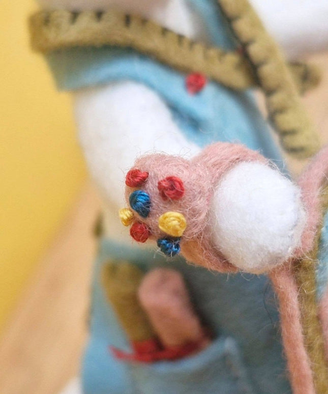 Close-up of a hand with a colorful bandage on a blurred background