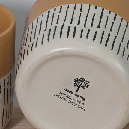 A close-up of the bottom of a ceramic mug