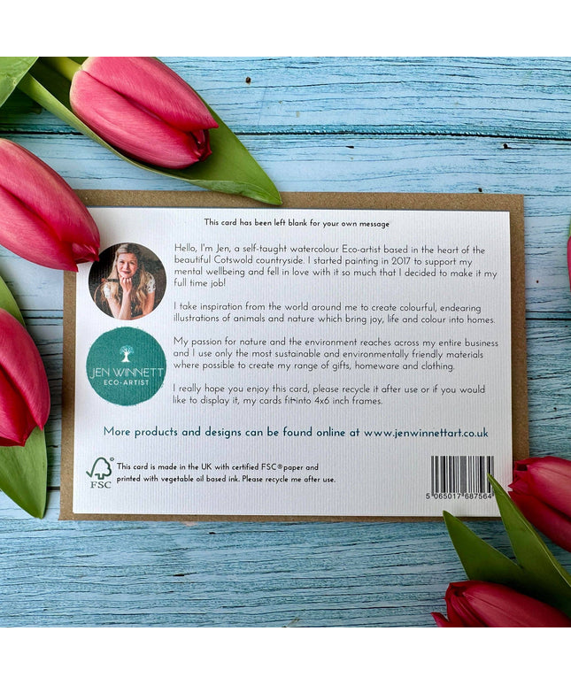 Card with text and Jen Winnett Eco-Artist branding surrounded by red tulips on a blue wooden surface