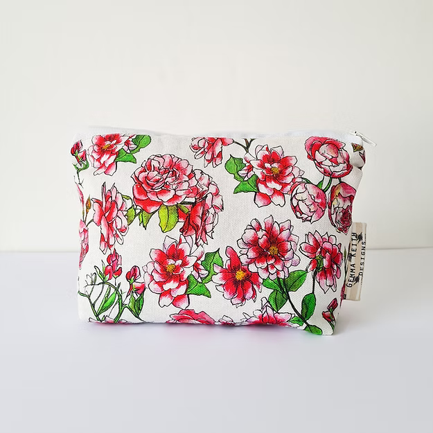 Floral-patterned pouch with a visible brand tag on a white background