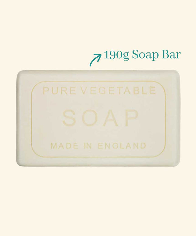 Bar of soap labeled 'Pure Vegetable Soap Made in England' with a weight indication on a beige background.