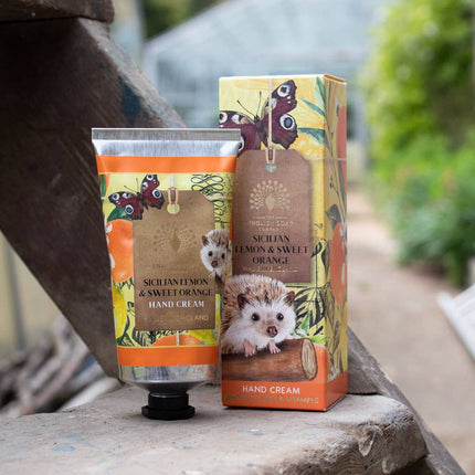 Hand cream and its packaging on a wooden surface with a natural background