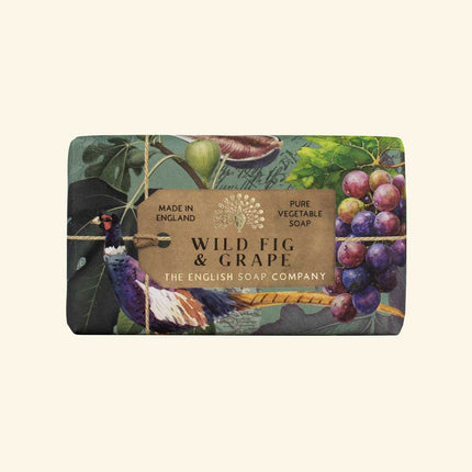 Soap bar with 'Wild Fig & Grape' label and decorative design on a beige background