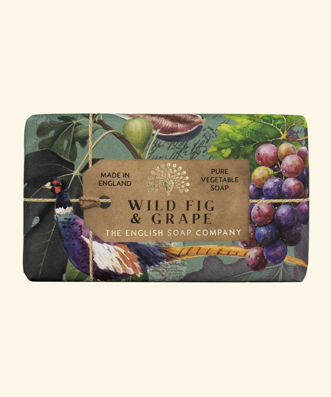 Soap bar with 'Wild Fig & Grape' label and decorative design on a beige background