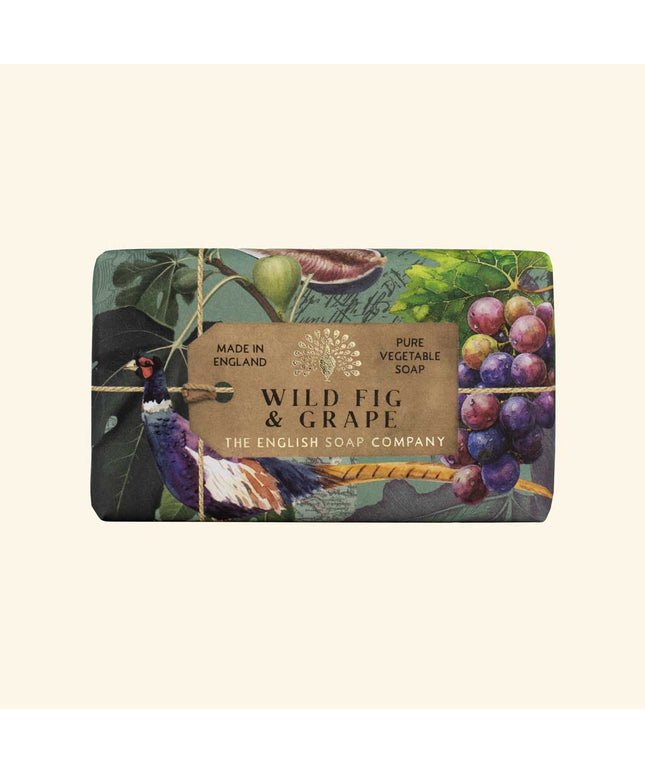Soap bar with 'Wild Fig & Grape' label and decorative design on a beige background