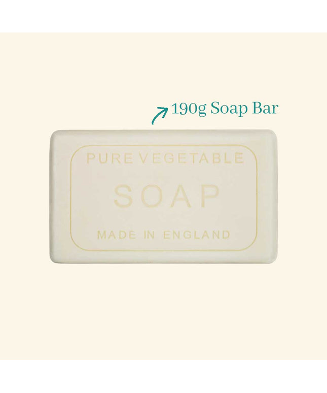 Bar of soap labeled 'Pure Vegetable Soap Made in England' with a weight indication on a beige background.
