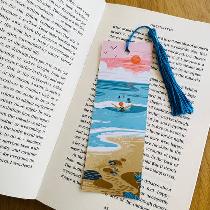 Bookmark with beach design on an open book