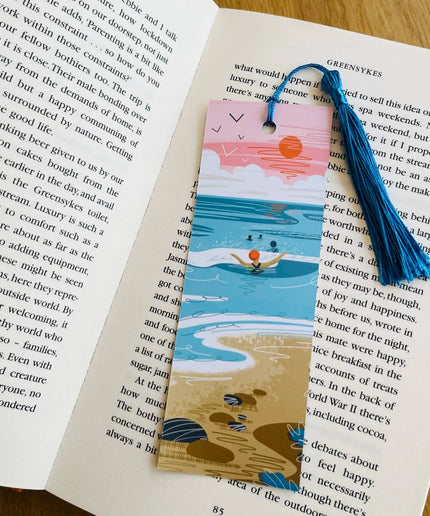 Bookmark with beach design on an open book