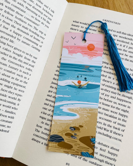 Bookmark with beach design on an open book