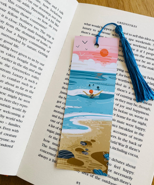Bookmark with beach design on an open book