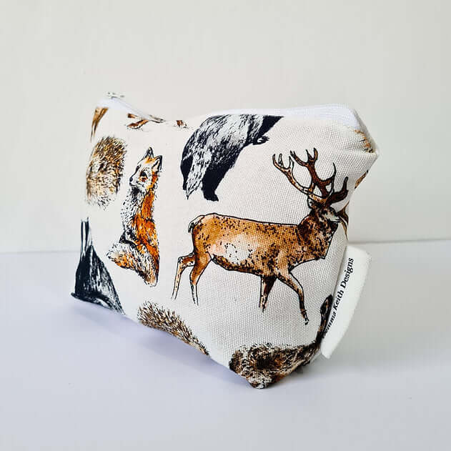 Fabric pouch with animal prints on a white background